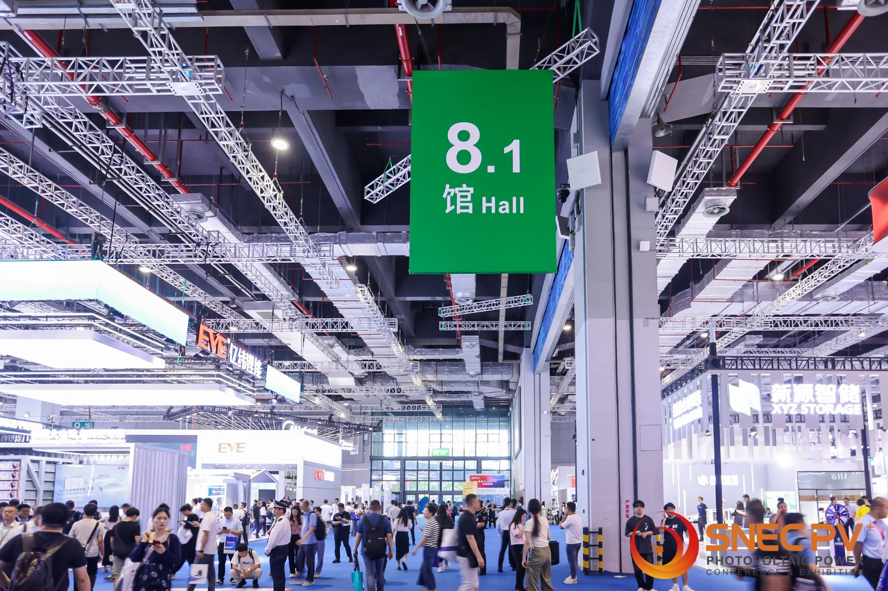 Crowded exhibition hall at SNEC Shanghai with hall 8.1 signage and renewable-energy exhibitors